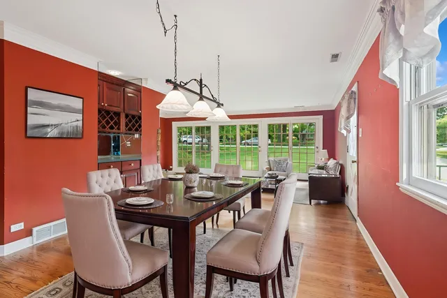 a front view of a house with a garden and yard