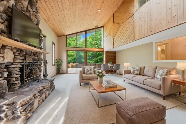 a view of a patio with a dining table and chairs