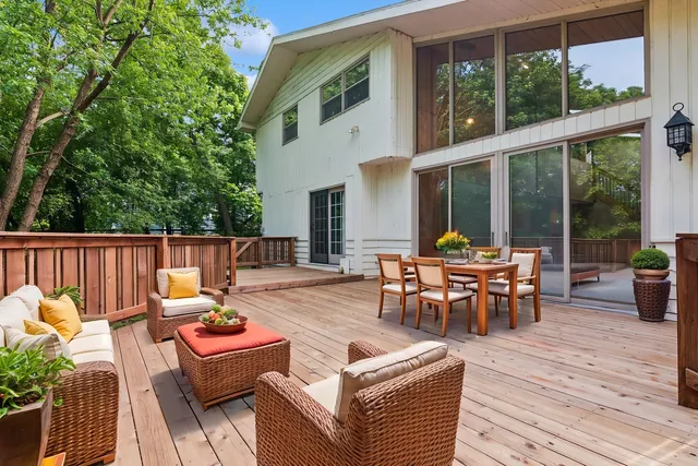 a view of backyard with wooden floor and fence