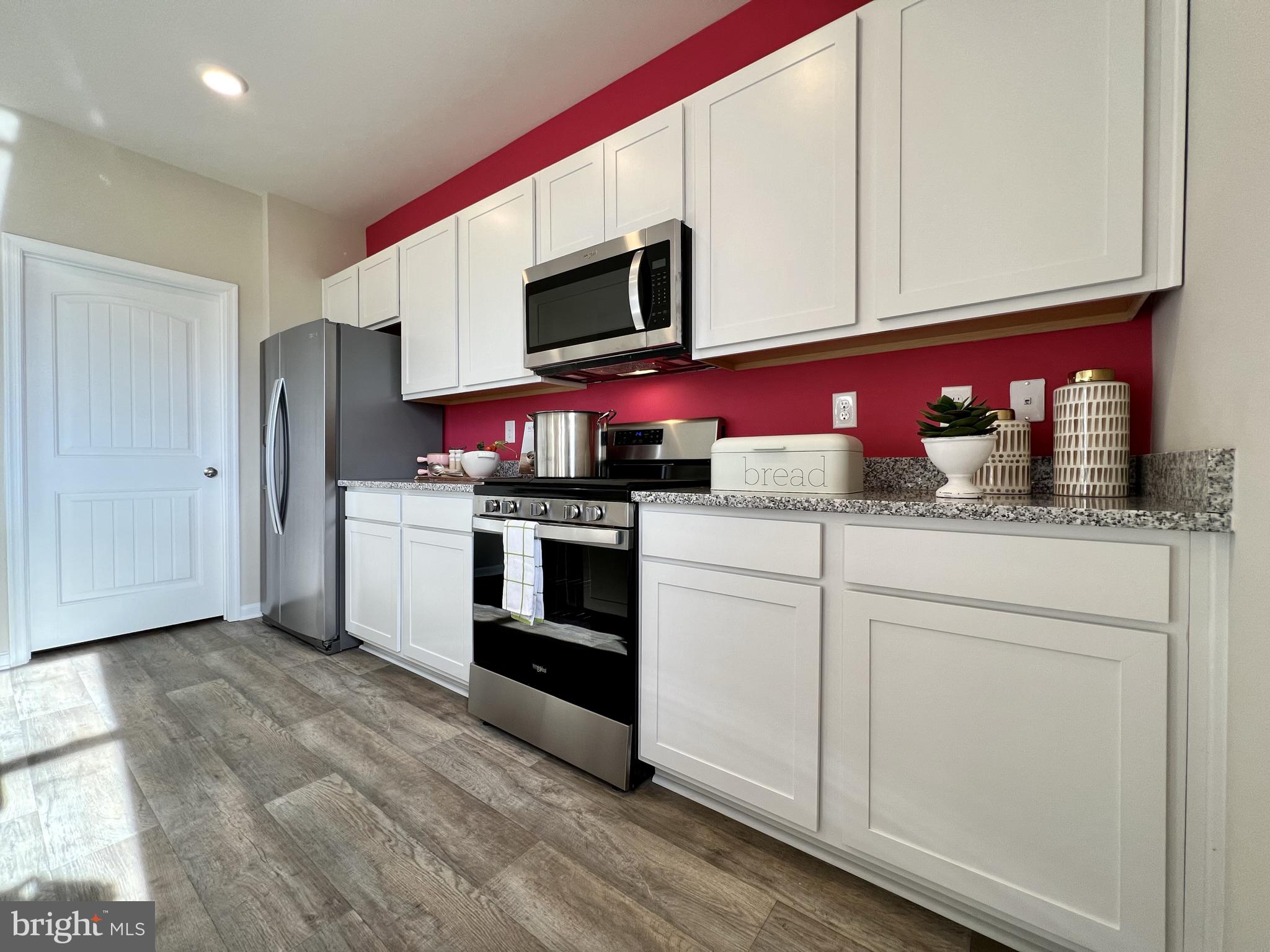 11 Buttercup Circle Elkton, MD 21921 - Photo 13 of 36 a kitchen with stainless steel appliances granite countertop a stove microwave and sink
