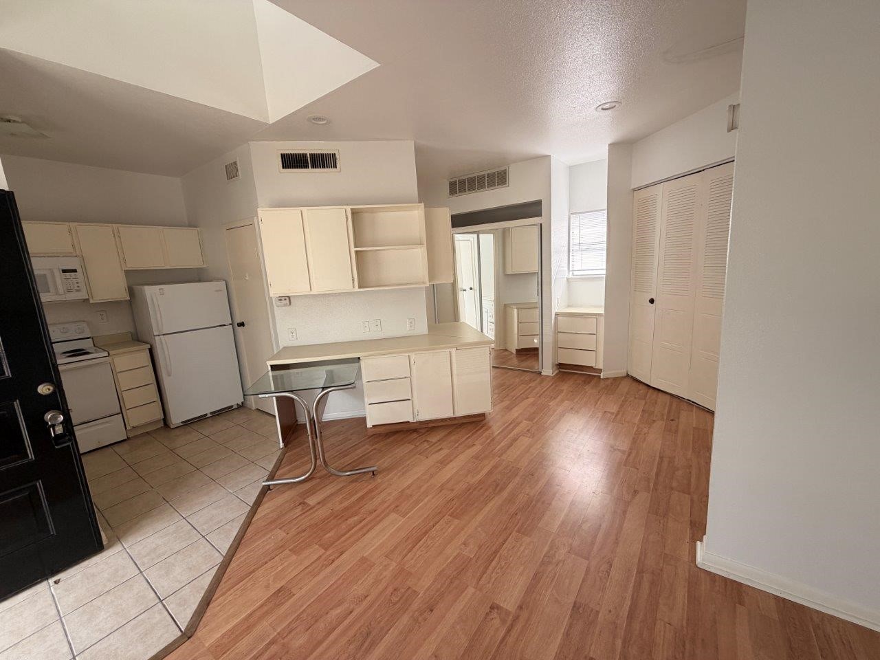 7901 Cambridge Street, Unit 104 Houston, TX 77054 - Photo 2 of 15 a room with wooden floor and furniture