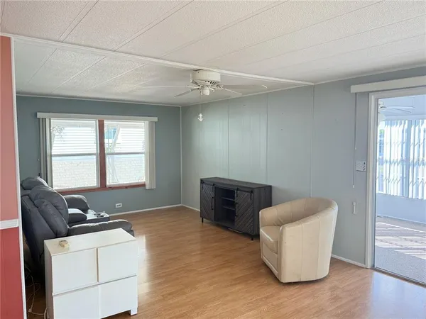 a living room with furniture and a window