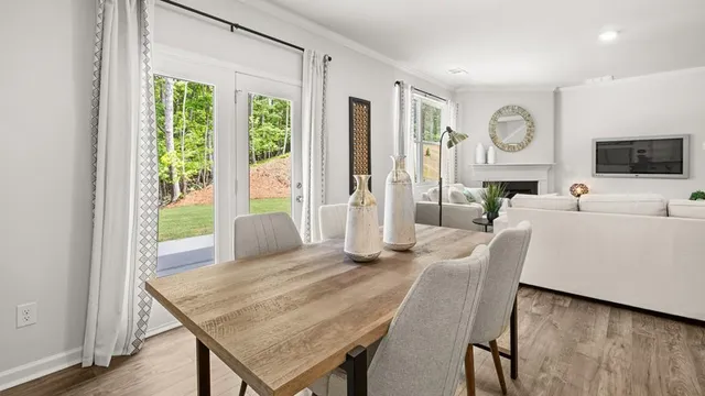 a view of a livingroom with furniture and a flat screen tv