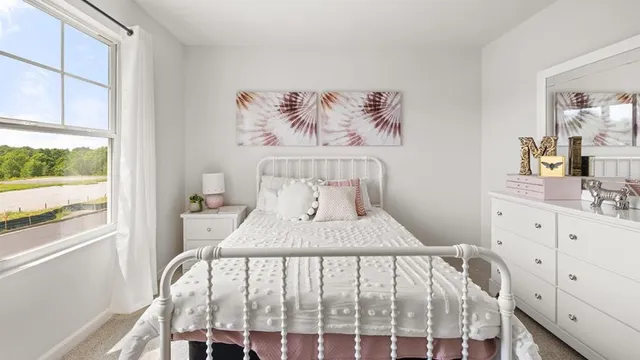 a bedroom with a bed and a table in it