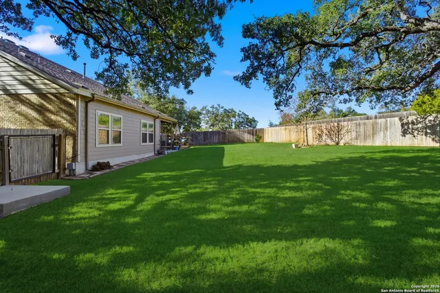 a view of a house with a back yard