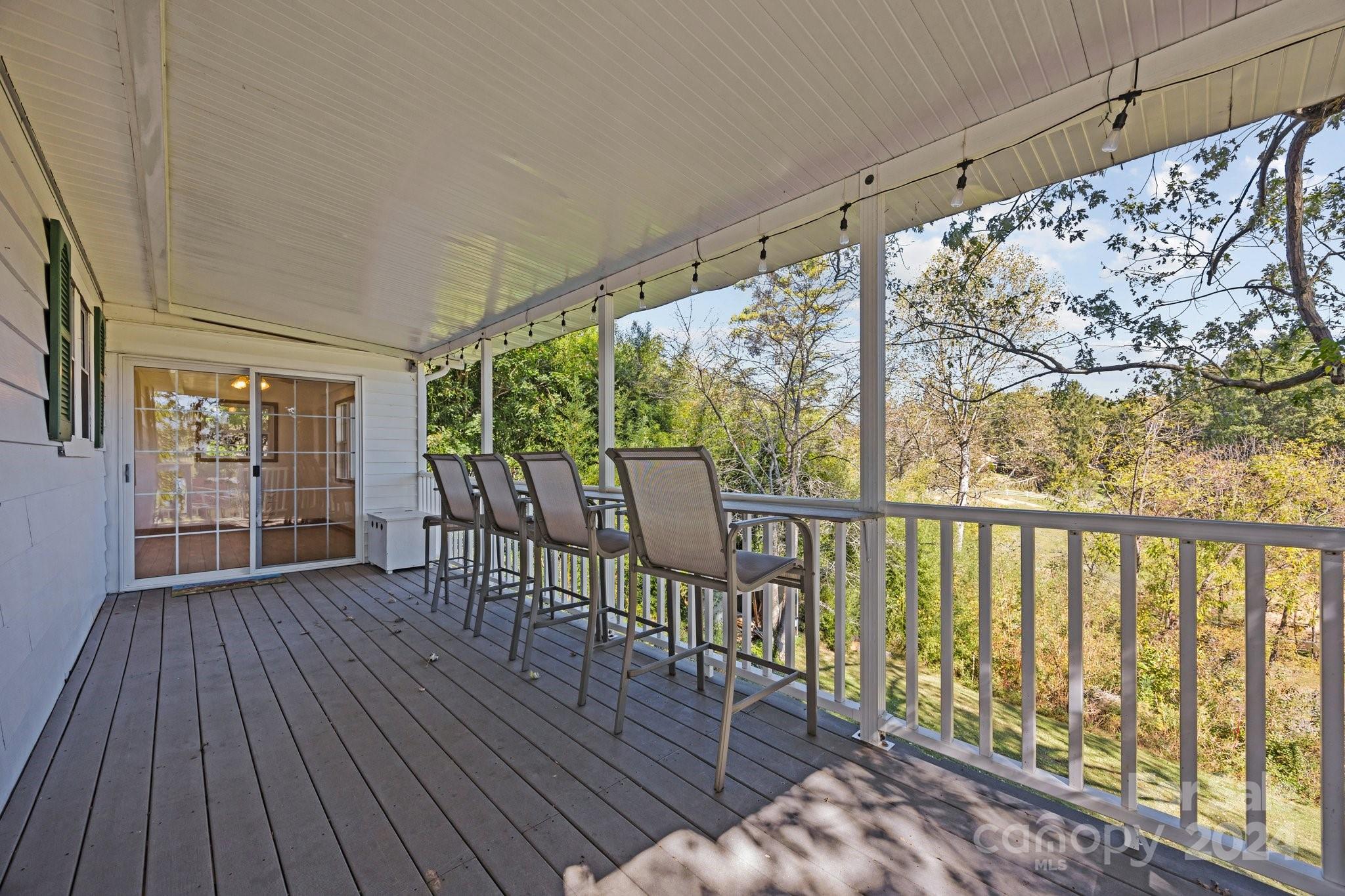 105 Hilltop Farm Road Canton, NC 28716 - Photo 20 of 48 a view of a chairs on the roof deck