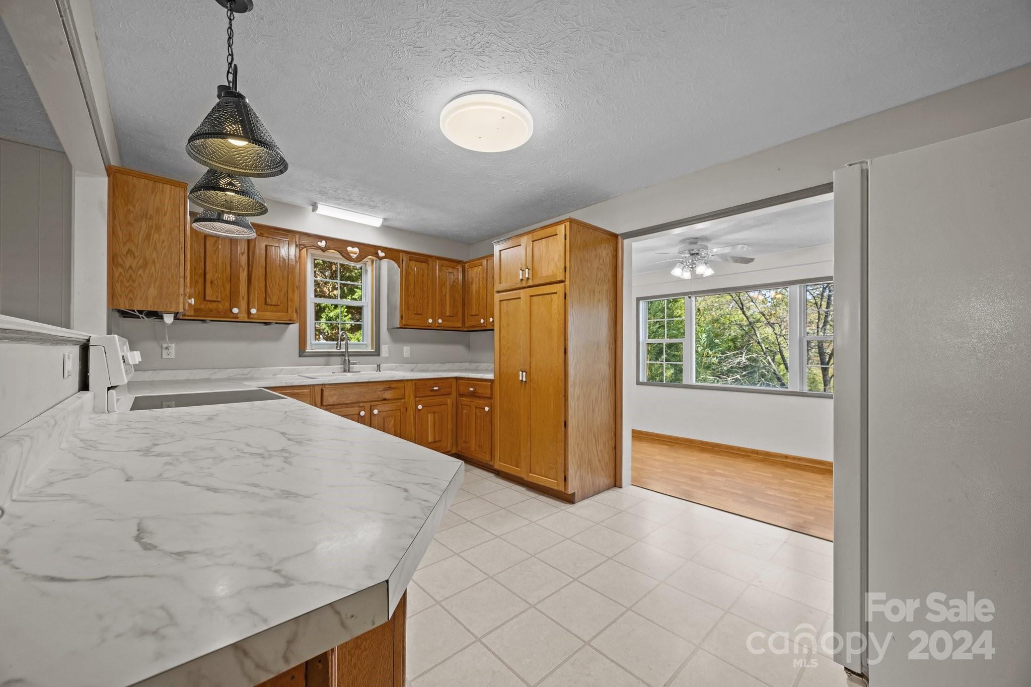 105 Hilltop Farm Road Canton, NC 28716 - Photo 26 of 48 a view of a kitchen with a sink and a window