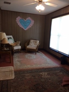 3381 Trotters Ridge Trail Gray, GA 31032 - Photo 12 of 15 a living room with furniture and a window