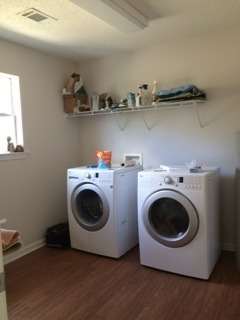 3381 Trotters Ridge Trail Gray, GA 31032 - Photo 14 of 15 a utility room with dryer and washer