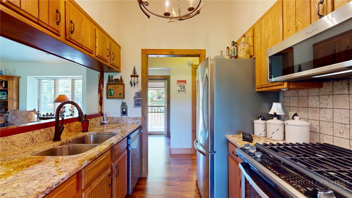 250 Ridgeview Road, Unit 43 Sugar Mountain, NC 28604 - Photo 10 of 21 a kitchen with stainless steel appliances granite countertop a sink and a stove
