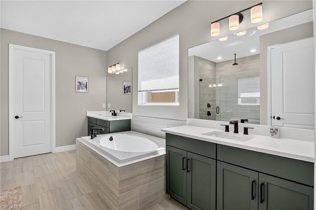 2082 Grove Drive Naples, FL 34120 - Photo 21 of 50 a bathroom with a sink and mirror