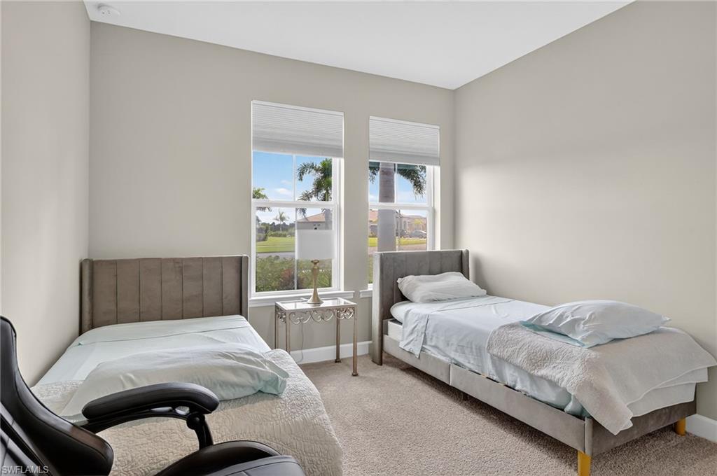 2082 Grove Drive Naples, FL 34120 - Photo 27 of 50 a bedroom with a bed and a large window