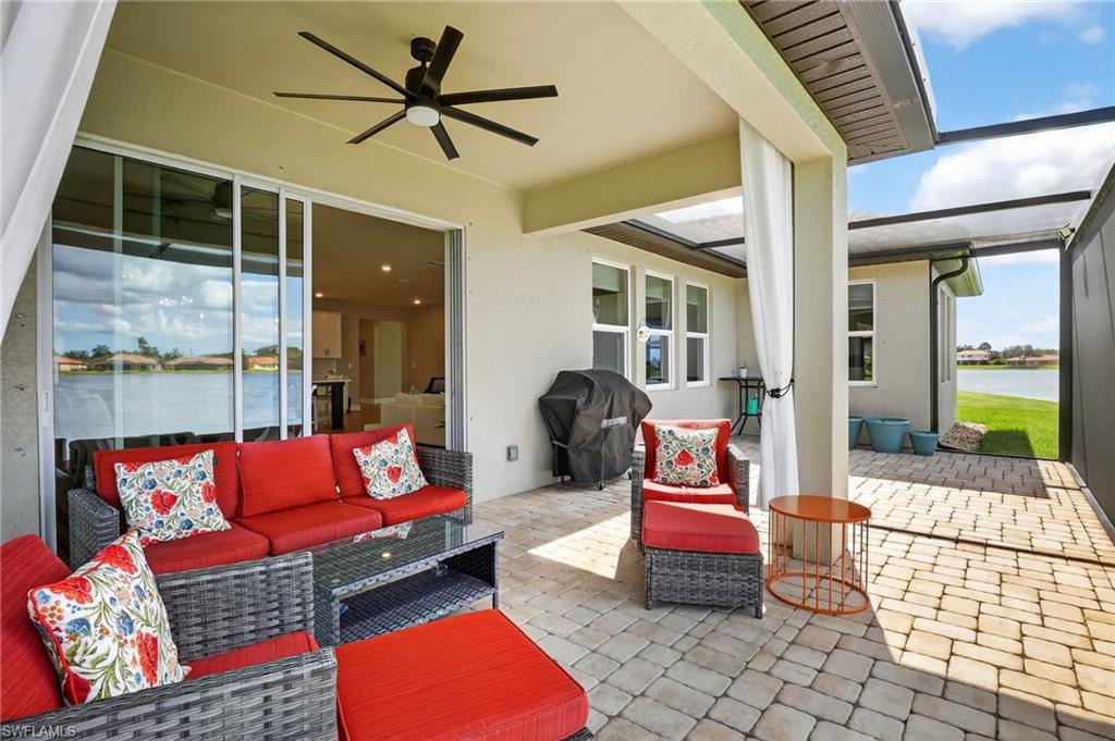 2082 Grove Drive Naples, FL 34120 - Photo 36 of 50 a outdoor living space with furniture and a potted plant