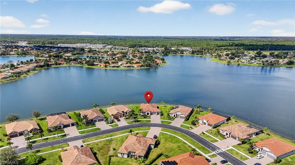 2082 Grove Drive Naples, FL 34120 - Photo 42 of 50 an aerial view of a house with a lake view
