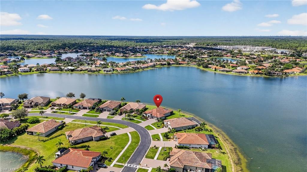 2082 Grove Drive Naples, FL 34120 - Photo 43 of 50 an aerial view of a houses with a lake view