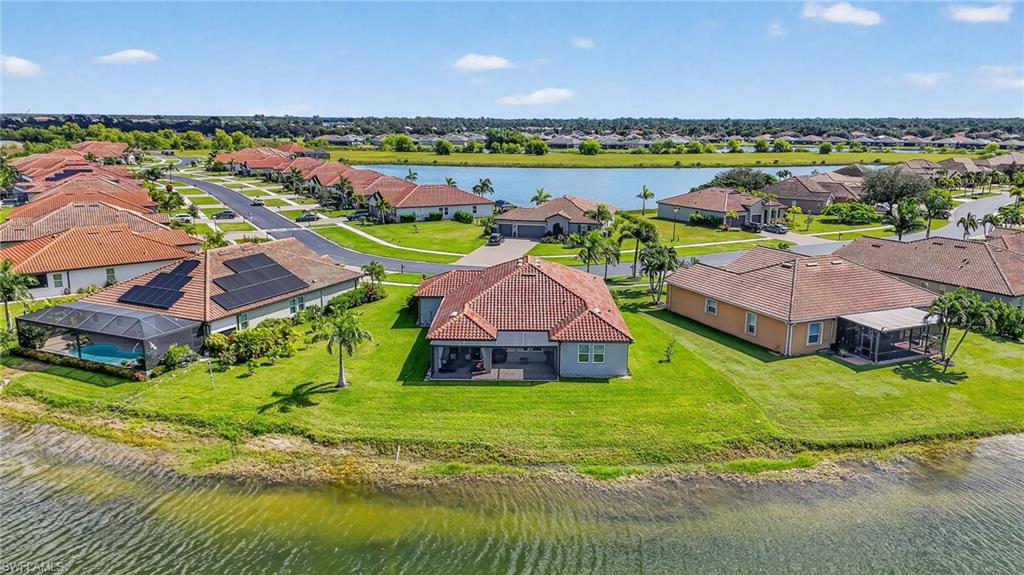 2082 Grove Drive Naples, FL 34120 - Photo 45 of 50 an aerial view of residential houses with outdoor space and trees