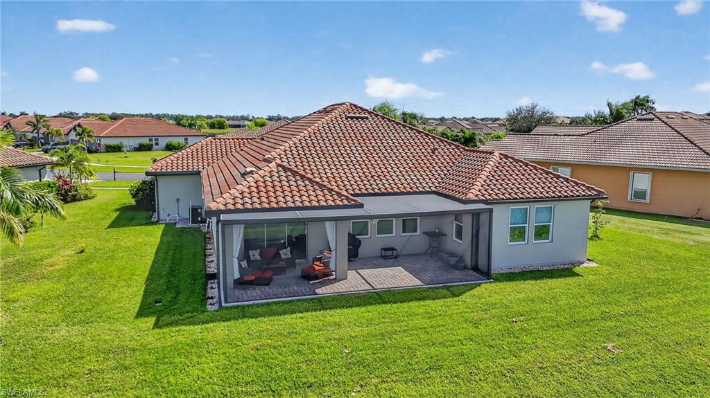 2082 Grove Drive Naples, FL 34120 - Photo 47 of 50 a view of a house with a yard balcony and a garden
