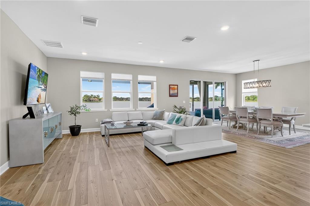 2082 Grove Drive Naples, FL 34120 - Photo 5 of 50 a living room with furniture and a flat screen tv
