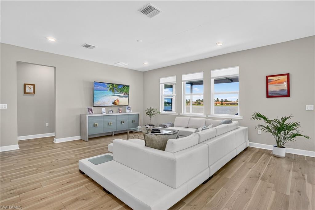 2082 Grove Drive Naples, FL 34120 - Photo 6 of 50 a living room with furniture and a large window