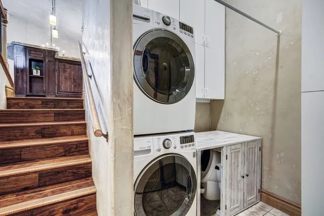 a view of a hallway with washer and dryer