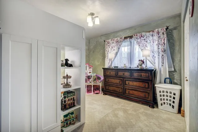 a view of room with furniture and closet