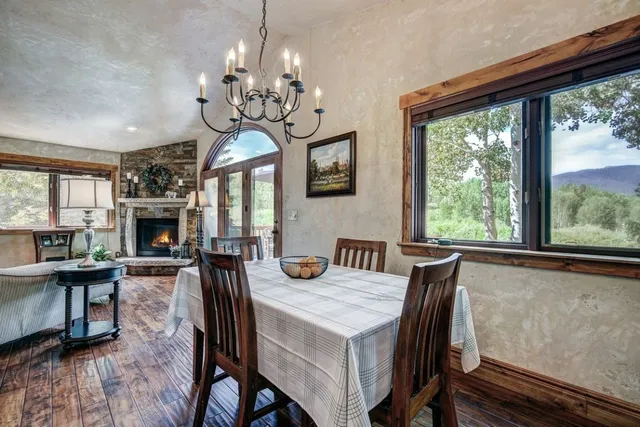 a view of a dining room with furniture window and wooden floor