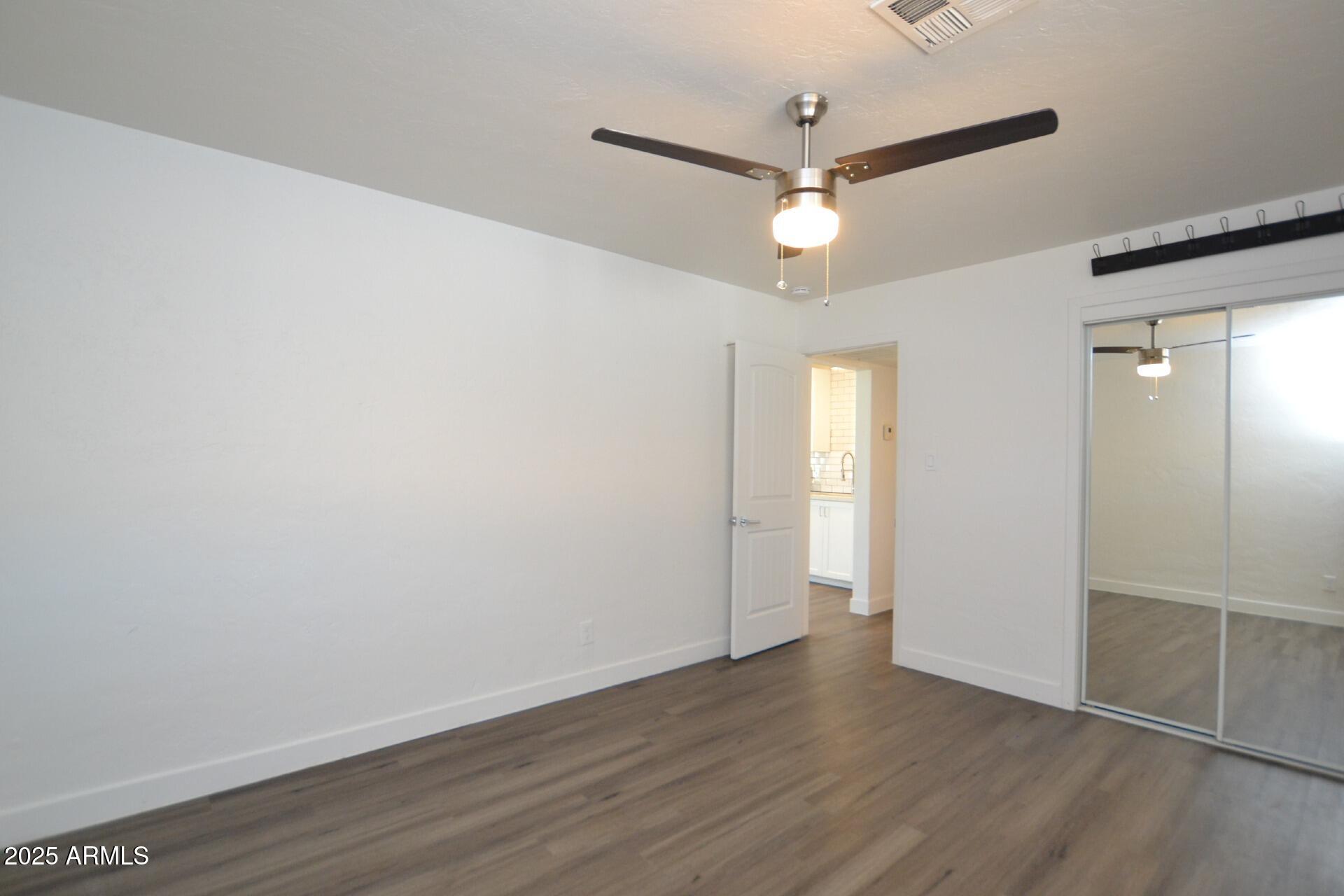 1202 East Kaler Drive, Unit 3 Phoenix, AZ 85020 - Photo 6 of 9 wooden floor in an empty room
