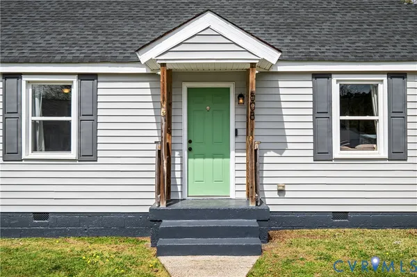 a view of a entryway door front of a house