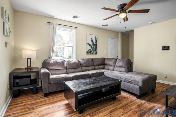 a living room with furniture and a window