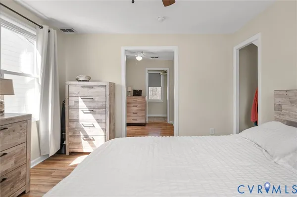 a bedroom with a bed and a dresser