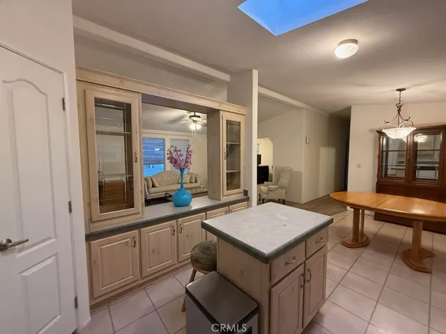 a room with a table chairs and projector view