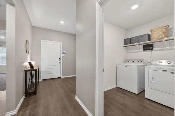 a view of hallway with washer and dryer