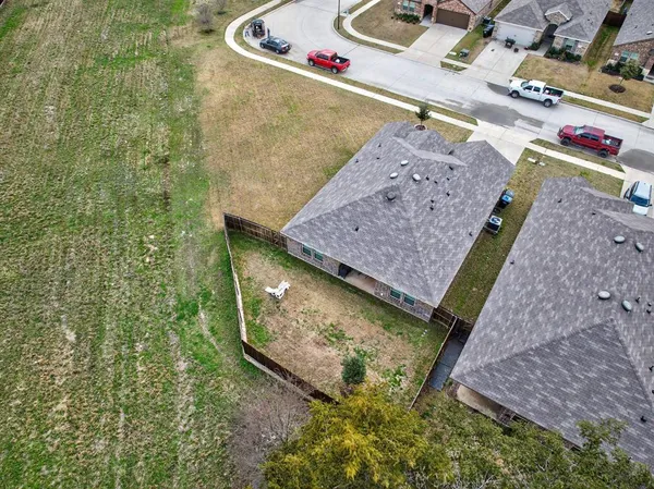 a view of a pool with a yard