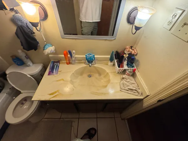 a bathroom with a sink and a mirror