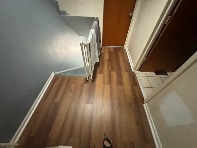 a view of wooden floor in hallway