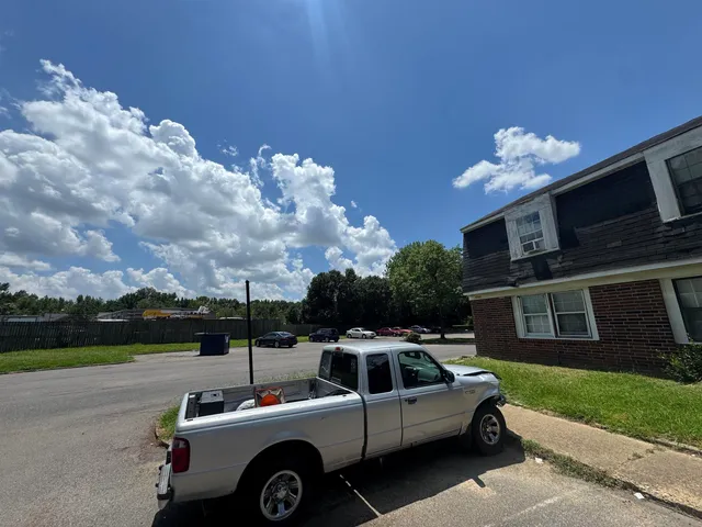 a view of a car parked in front of a house