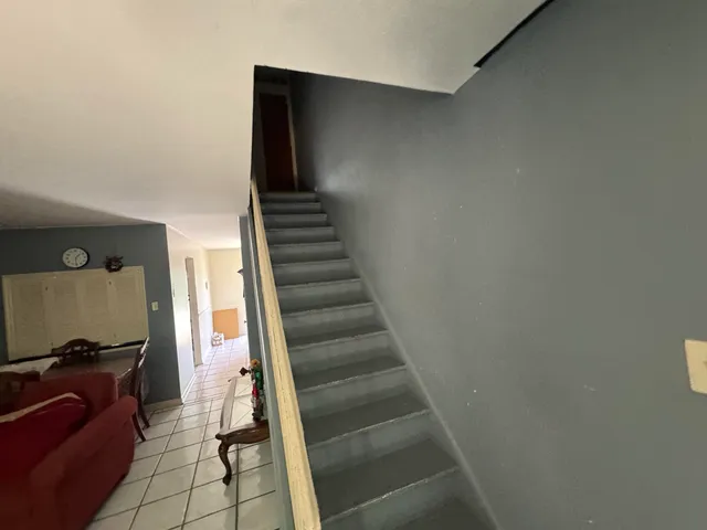 a view of a hallway with staircase