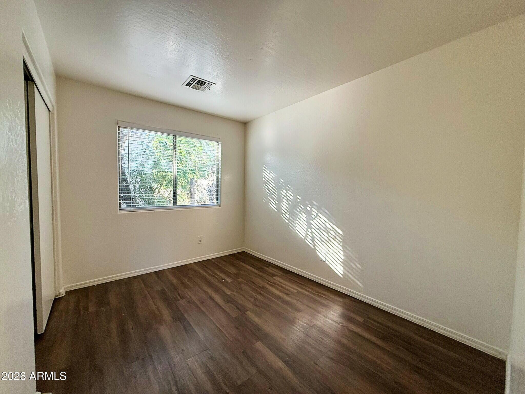 10010 North 7th Avenue, Unit 2 Phoenix, AZ 85021 - Photo 13 of 21 a view of an empty room and window