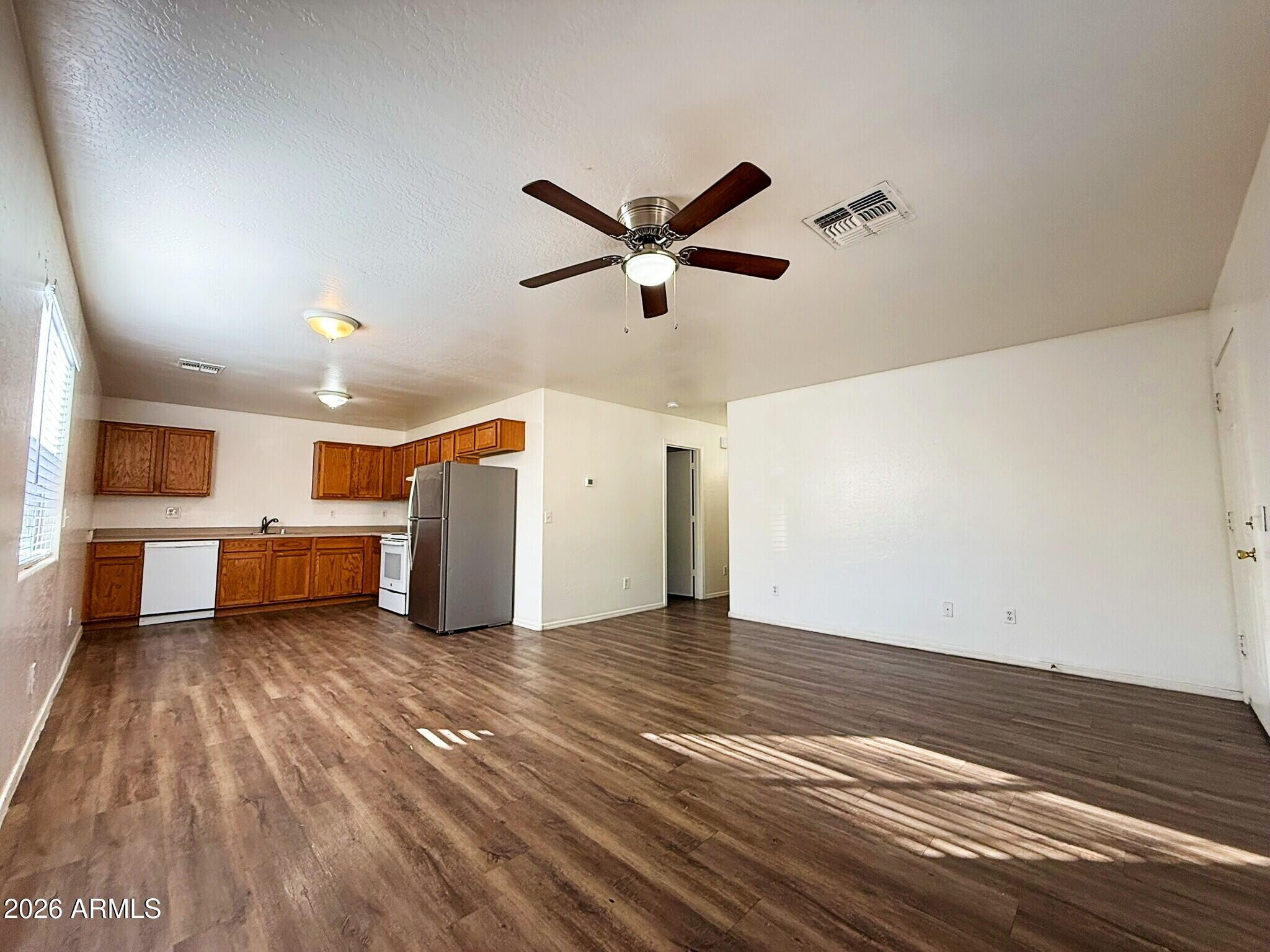 10010 North 7th Avenue, Unit 2 Phoenix, AZ 85021 - Photo 7 of 21 a view of a livingroom with a couch and a ceiling fan