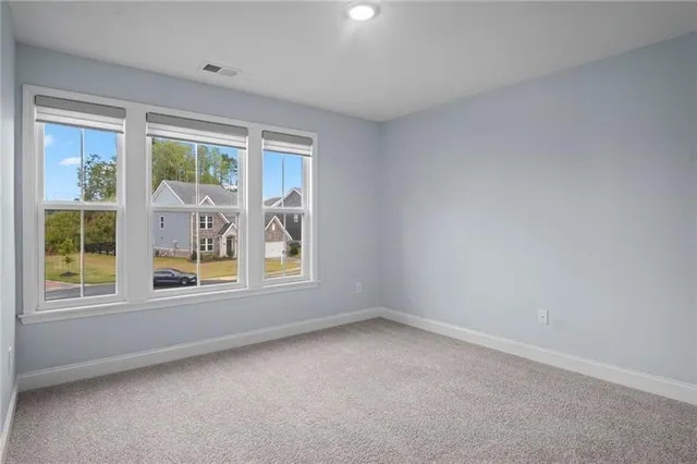a view of staircase with wooden floor and white walls