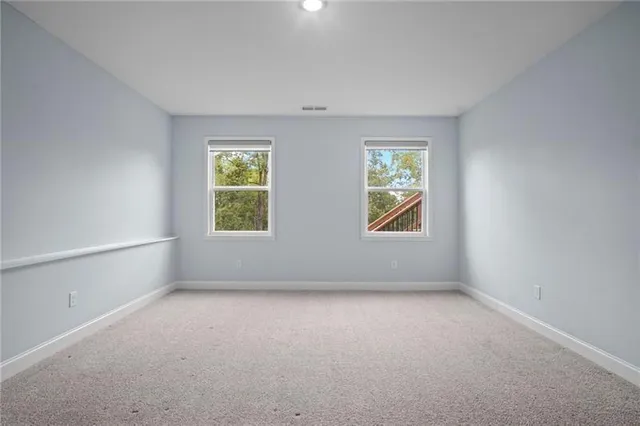 a view of a house with a yard and sitting area