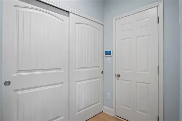 an aerial view of a house with pool lake view and mountain view