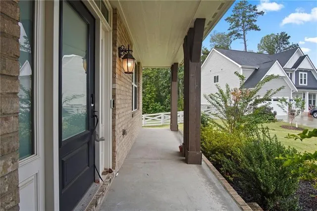 a kitchen with kitchen island granite countertop appliances cabinets and a sink