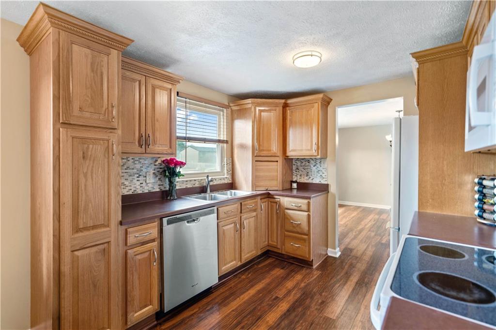 320 Celestial Drive Freedom, PA 15042 - Photo 14 of 28 a kitchen with stainless steel appliances granite countertop a stove and a refrigerator