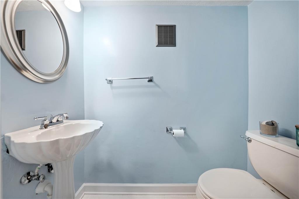 320 Celestial Drive Freedom, PA 15042 - Photo 16 of 28 a bathroom with a sink a mirror and a toilet