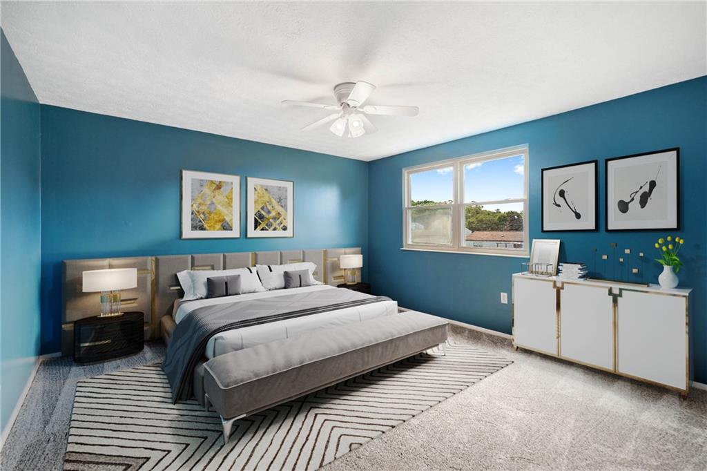 320 Celestial Drive Freedom, PA 15042 - Photo 23 of 28 a bedroom with a large bed and a tv