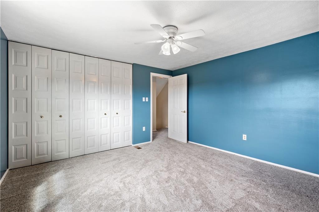 320 Celestial Drive Freedom, PA 15042 - Photo 24 of 28 a view of an empty room with a chandelier fan