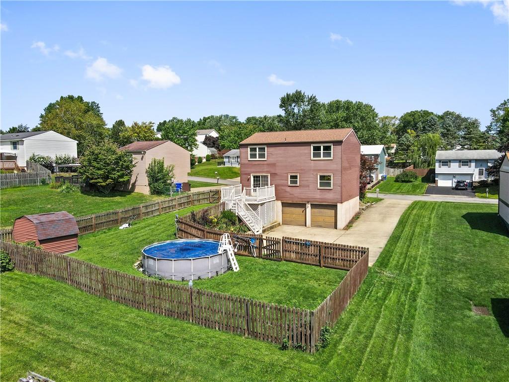 320 Celestial Drive Freedom, PA 15042 - Photo 6 of 28 a view of a house with a big yard potted plants and a large tree