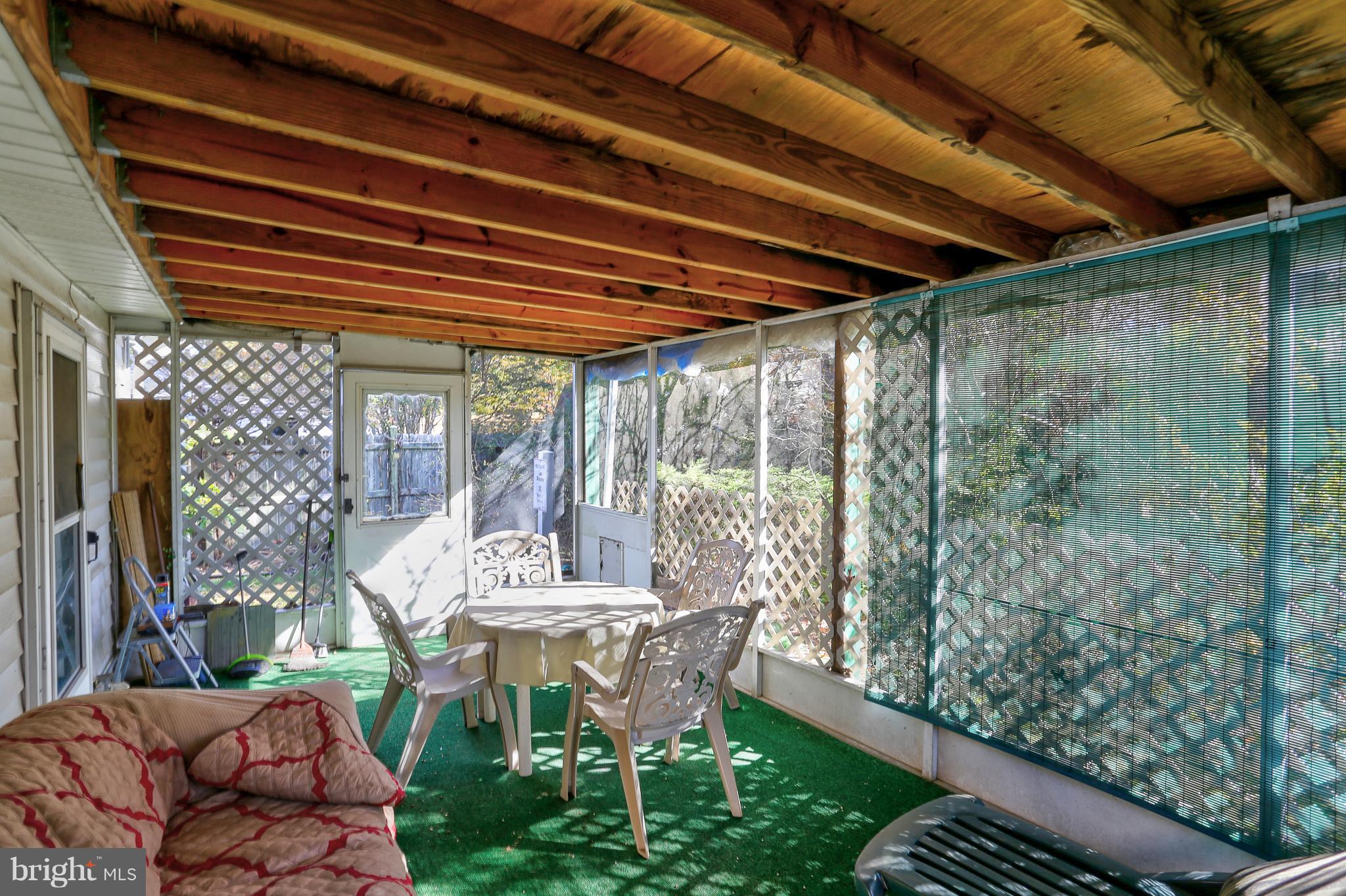 7141 Fairbrook Road Baltimore, MD 21244 - Photo 27 of 28 Rear Enclosed Patio