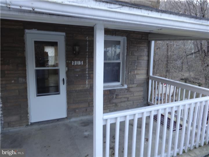 a view of a porch of a house